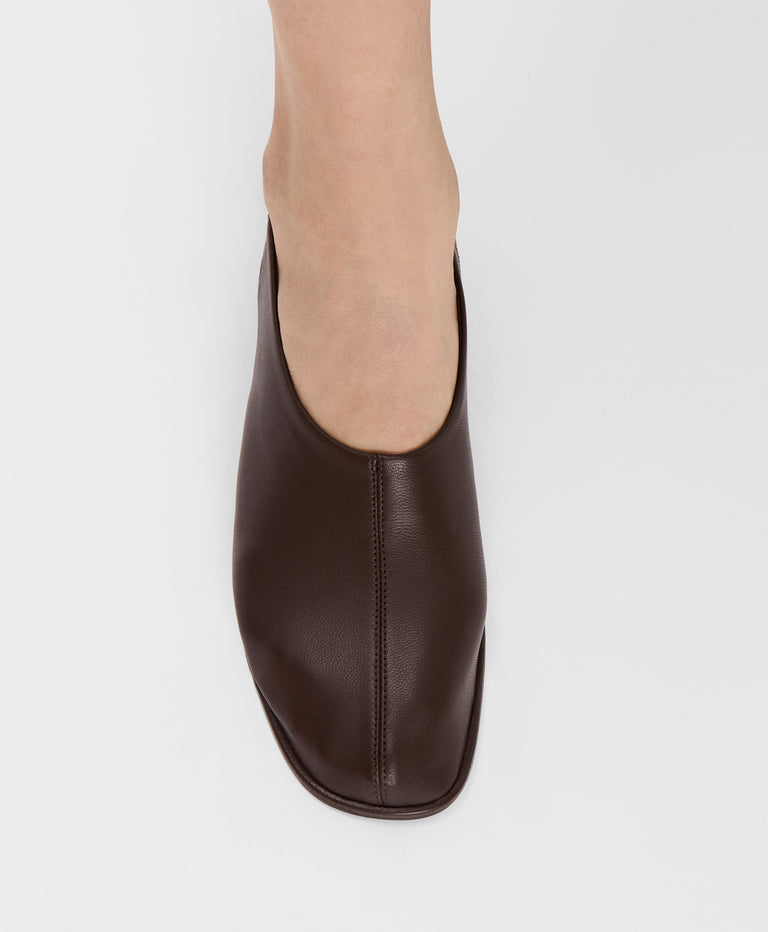 Model wears Glove Slip On in Chocolate