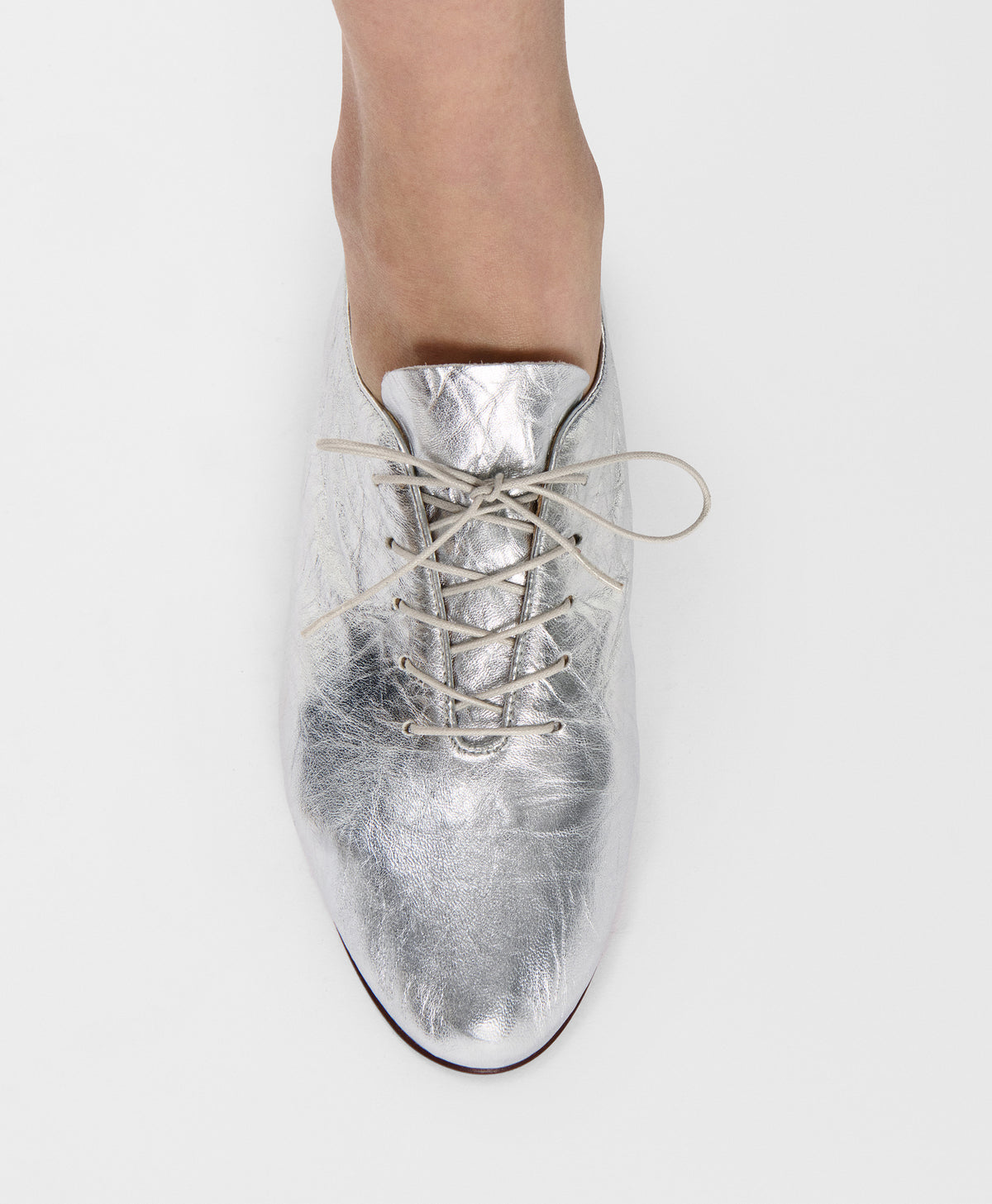 Model wears the Oxford Ballerina  in Crinkled Silver