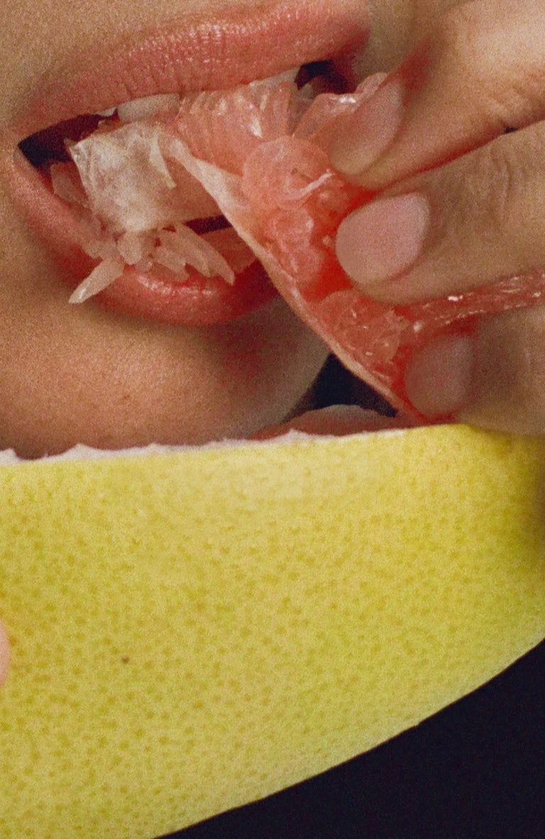 Model eating pomelo